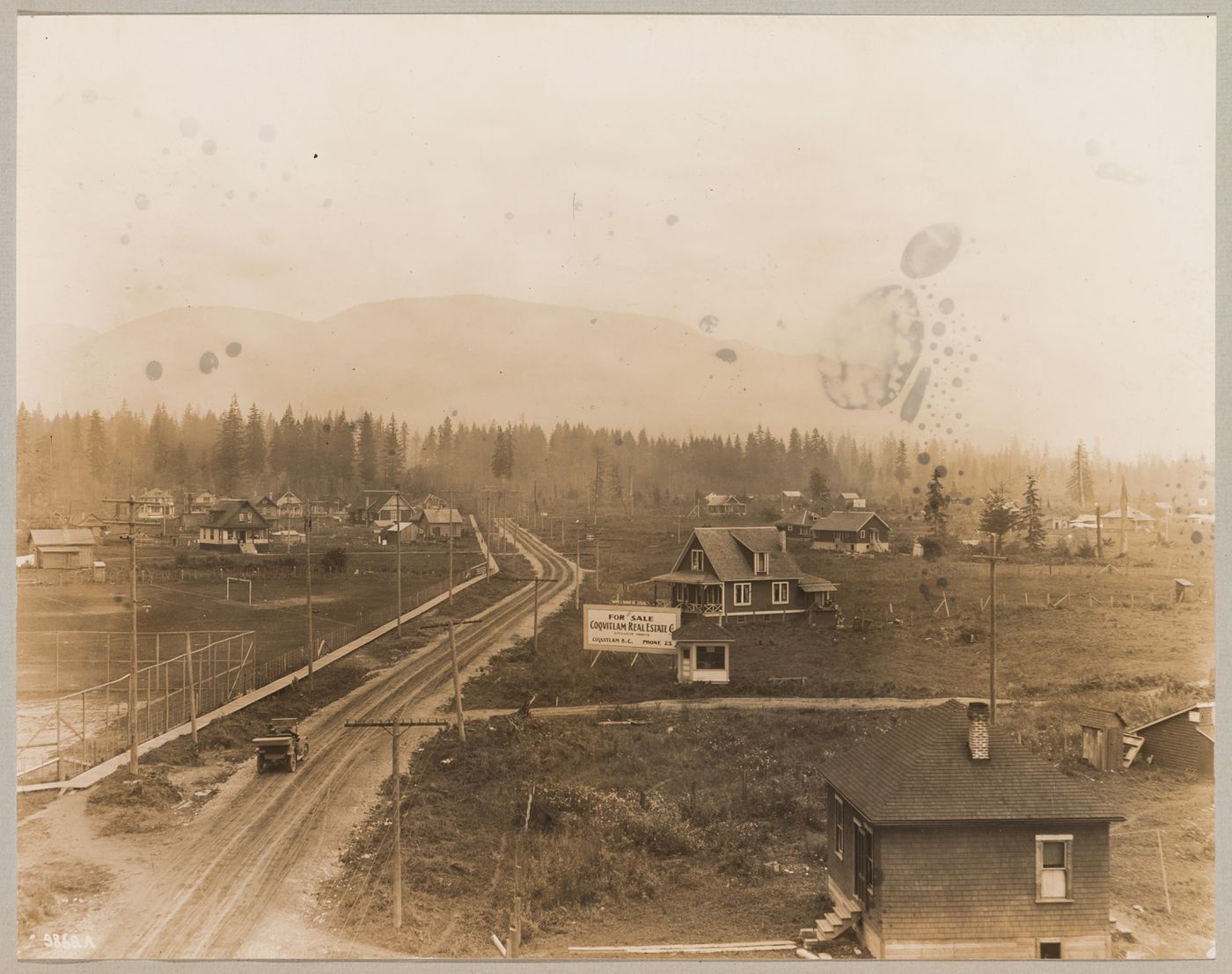 View of houses with athletic fields on the left, Coquitlam (now Port Coquitlam), British Columbia