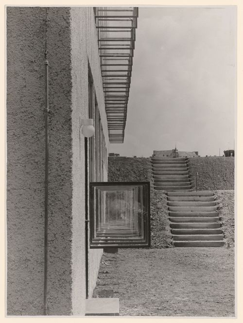 View of unidentified building exterior view along façade and opened windows and outdoor steps, Aachen [?], Germany