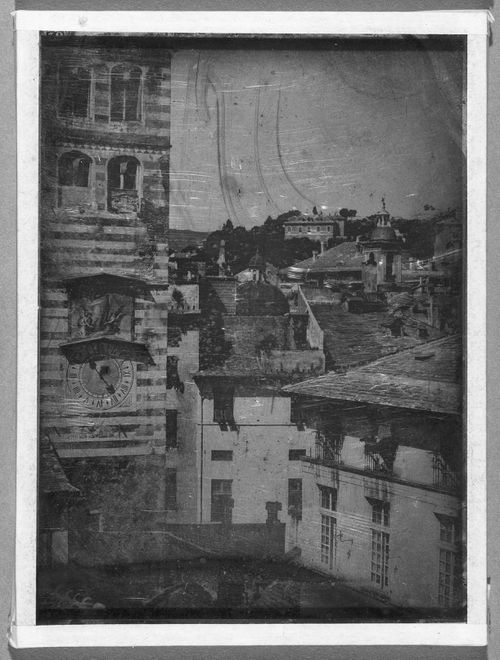 View of town and clock tower, Genoa, Italy