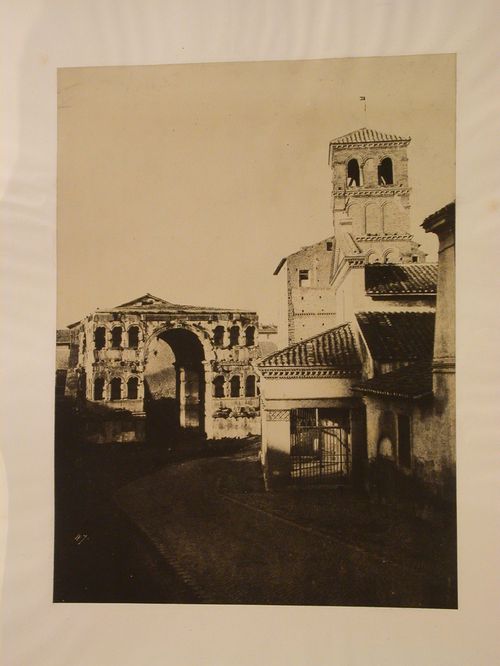 View of San Giorgio in Velabro and Arch of Janus, separated by a winding road, Rome, Italy