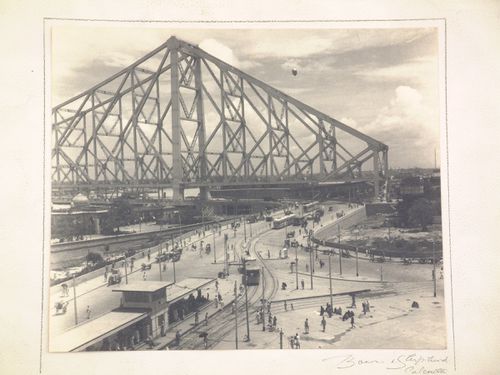 View of Kolkata tram and Howrah Bridge over the Hooghly River, West Bengal, India