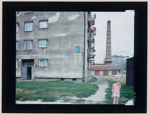 View of apartment houses, a child and a smokestack, Elblag, Poland (from the series "In between cities")