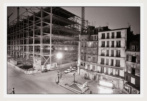 Night time view of Intersection of rue Beaubourg and rue Rambuteau at night with construction of Centre Georges Pompidou in background, Paris