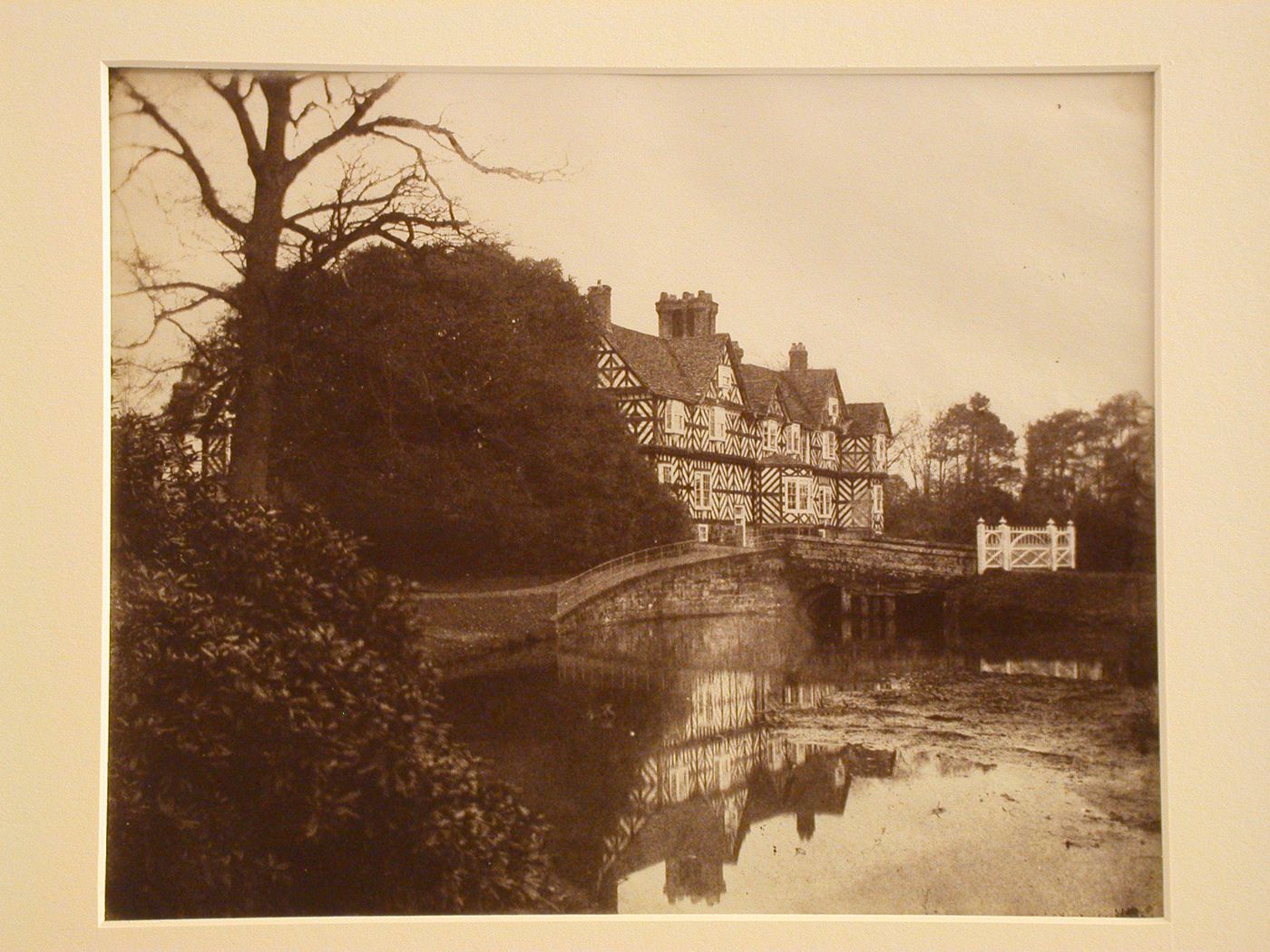 View of a large house beside a pond, Shropshire, England