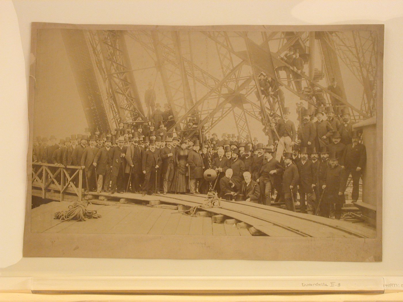Members of the Société Centrale des Architectes on the first platform of the Eiffel Tower during its construction, Paris, France
