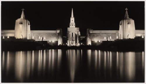 Night view across the Lake of the Nations showing the Festival Hall, Agricultural Hall, Arch of Triumph, Girl and Rainbow Fountain and the Tower of the Sun, Golden Gate International Exposition of 1939-1940, Treasure Island, San Francisco, California