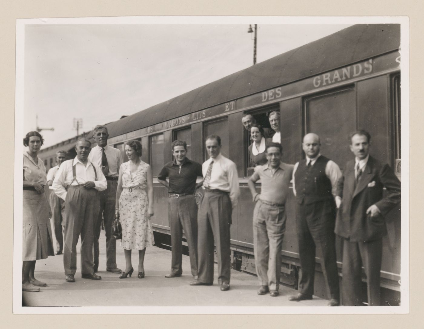 Group portrait of study tour members on a train stop in Hannover, Germany
