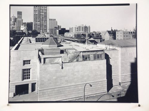 View of the Canadian Centre for Architecture under construction from the fifth floor of an apartment house on rue du Fort, Montréal, Québec