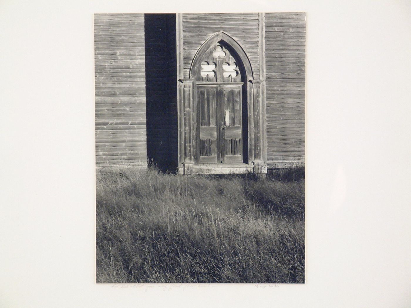 Detail of gothic-style wood door, on side of church