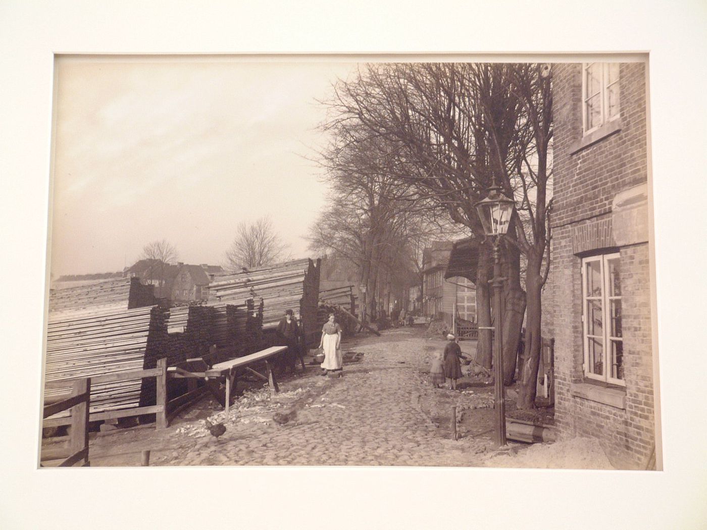 Houses and pedestrians along dike, Hamburg, Germany