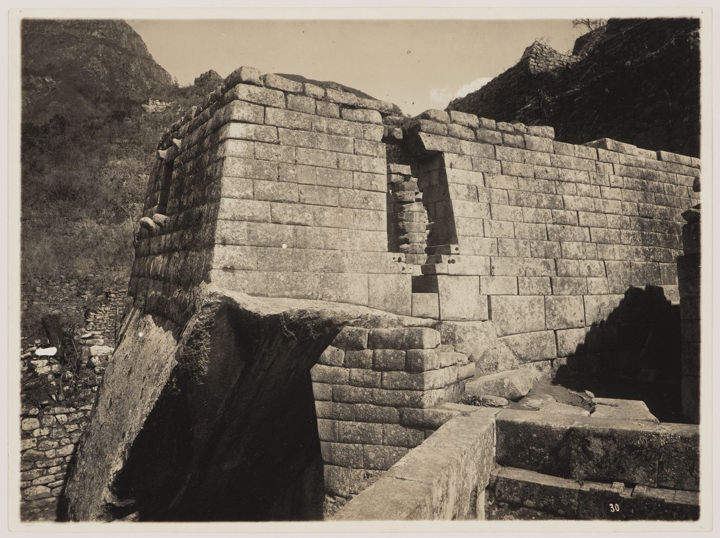 View of the Serpent Gate and Torreón with the entrance to the Royal Mausoleum and the principal liturgical bath, Machu Picchu, Peru