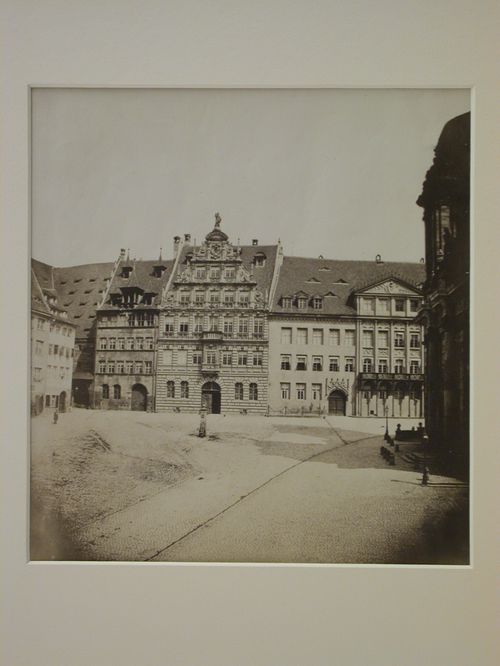View of large square enclosed by quaint old houses, Nuremberg [?], Germany