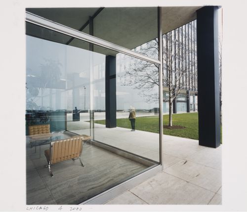 Exterior view of 860 Lake Shore Drive Apartments looking through the lobby furnished with barcelona chairs, showing Phyllis Lambert standing outside on the walkway, Chicago, Illinois