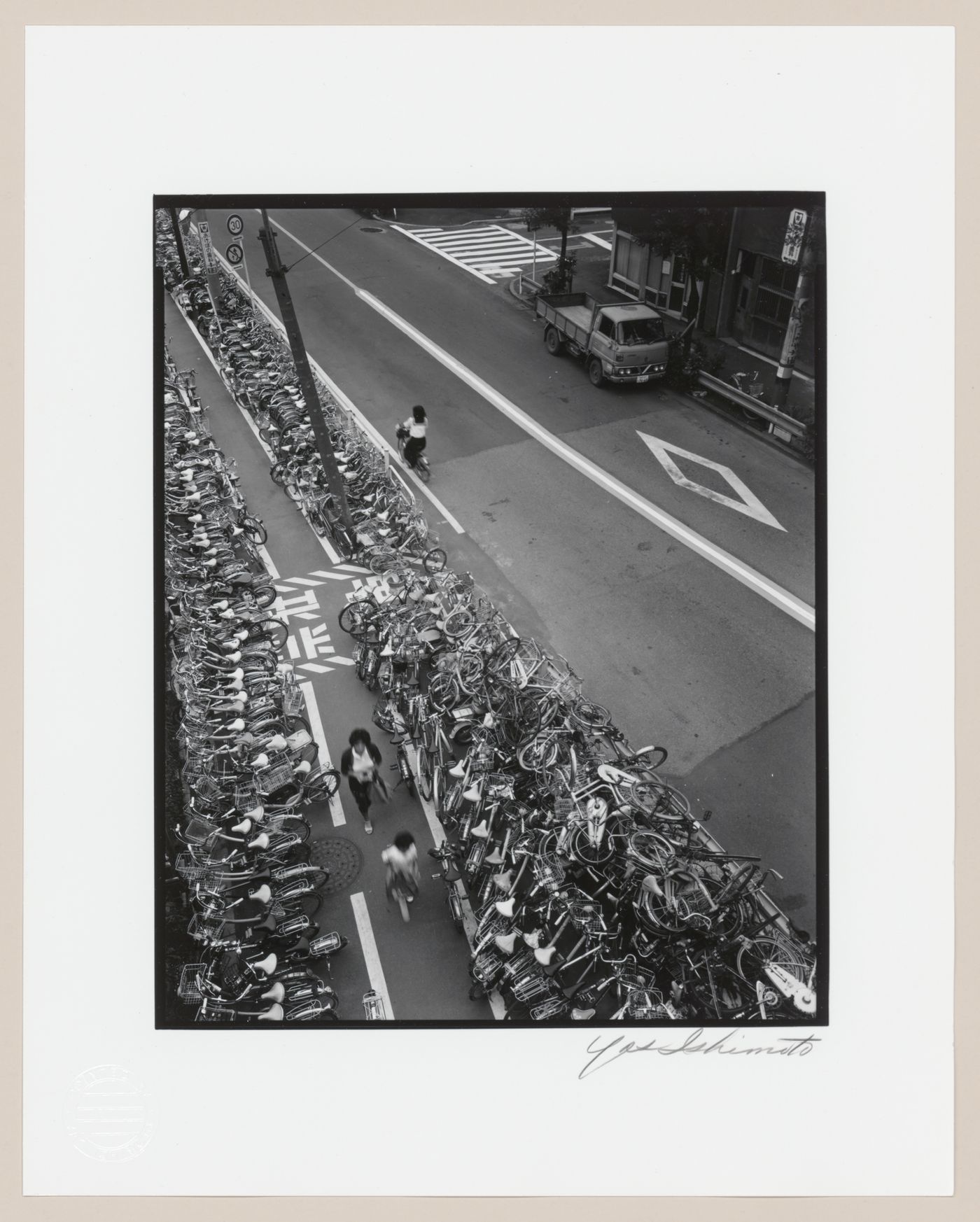 View of a street showing rows of parked bicycles, Tokyo, Japan