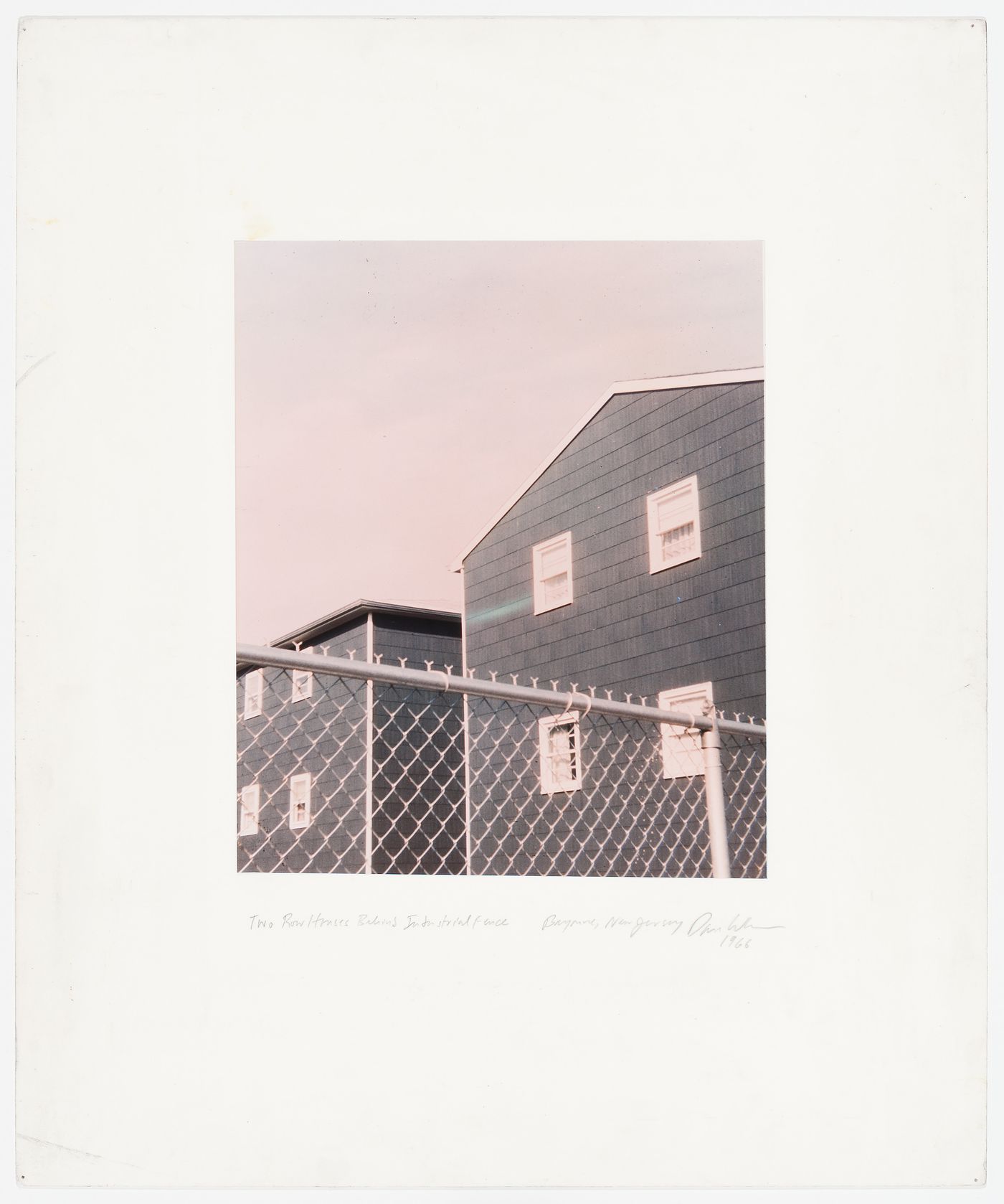 "Two Row Houses Behind Industrial Fence, Bayonne, New Jersey", United States, from the series "Homes for America"