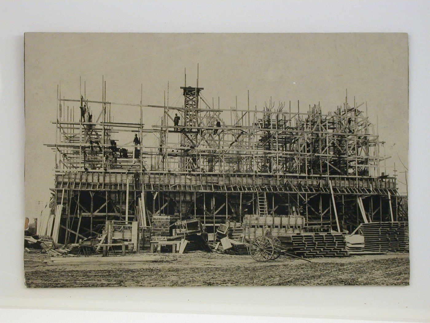 An unidentified wood-frame building under construction