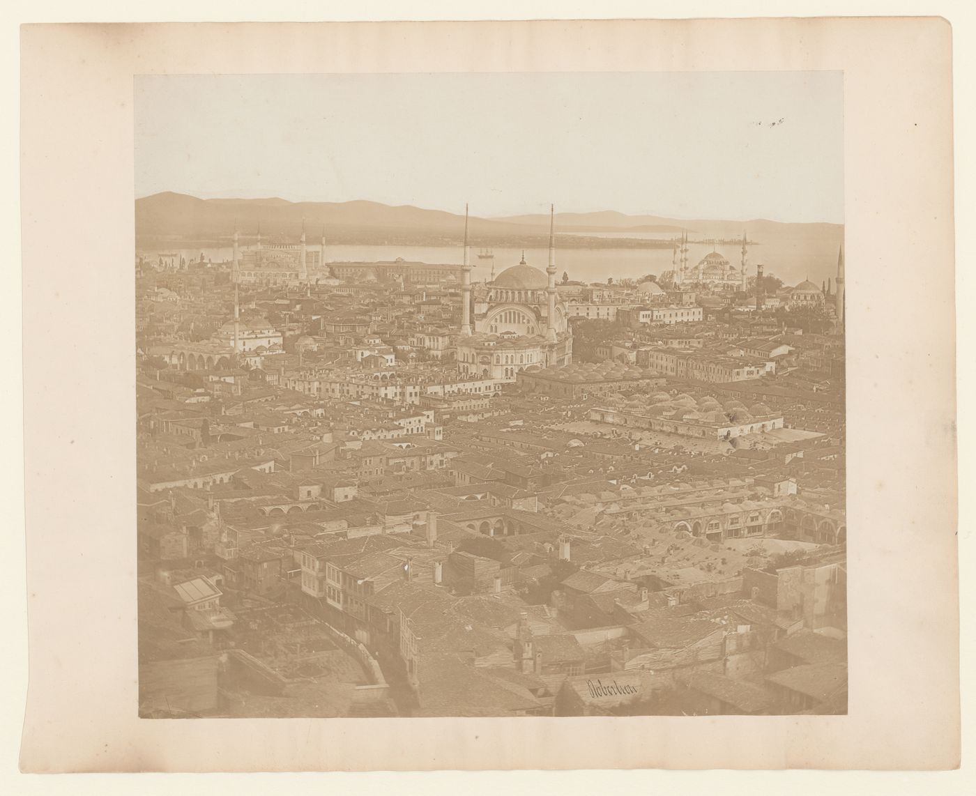 Partial view of Constantinople (now Istanbul) showing the Kapaliçarsi (also known as the Grand Bazaar), the Mahmut Pasa Camii, the Nuruosmaniye Camii, Hagia Sophia (also now known as the Ayasofya Müzesi), a university, the Sultanahmet Camii (also known as