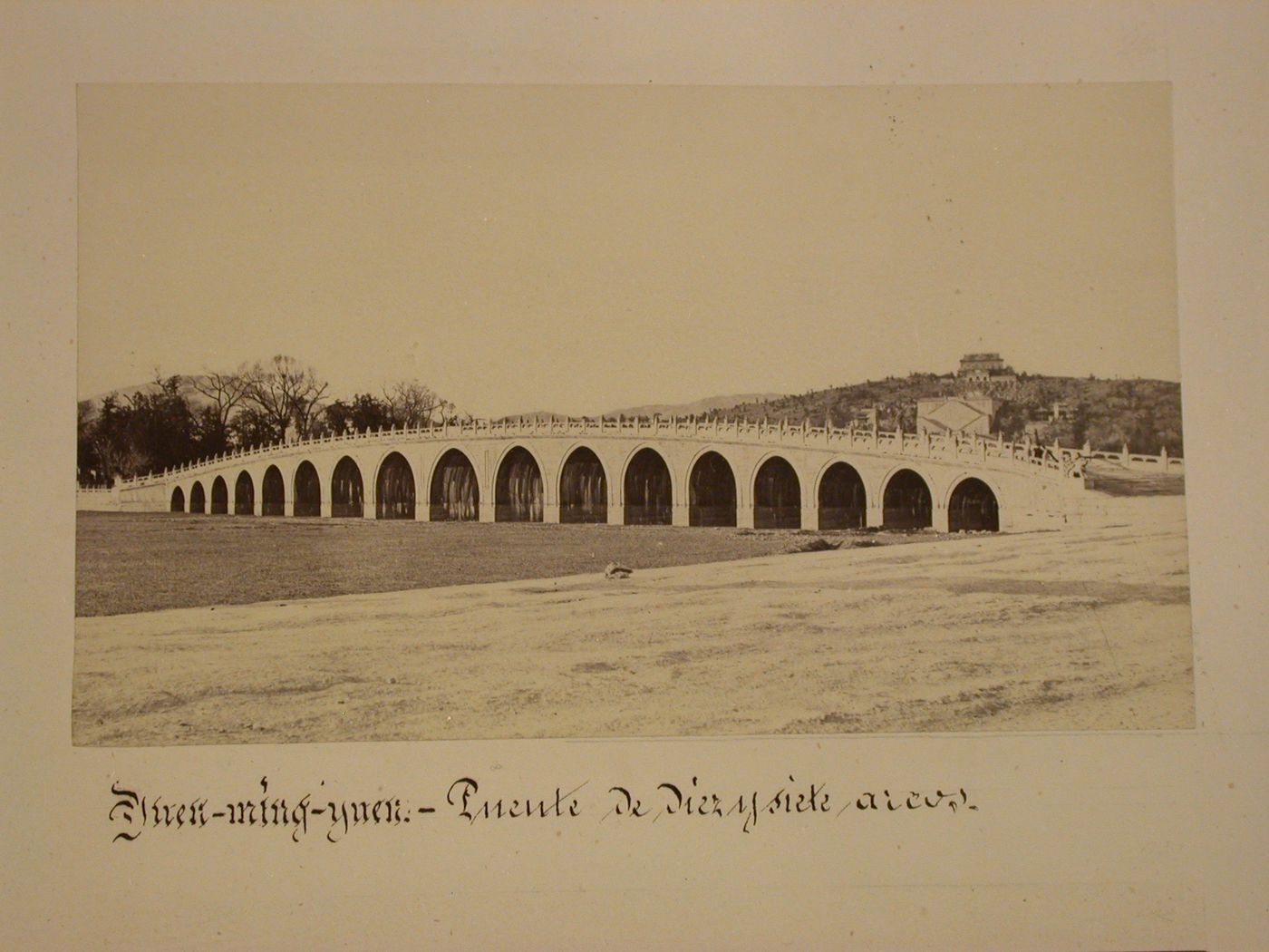 View of the Seventeen-Arch Bridge with Longevity Hill [Wanshou Shan] in the background, Garden of the Clear Ripples [Qing Yi Yuan] (now known as the Summer Palace or Yihe Yuan), Peking (now Beijing), China
