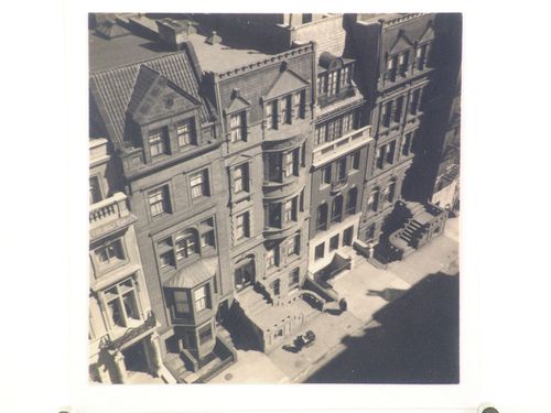 Looking down on street of stone townhouses, New York City, New York ?