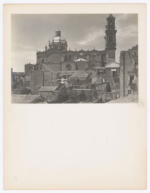 View of a façade of Santa Prisca showing the dome, the nave and a tower with houses in the foreground, Taxco de Alarcón, Mexico