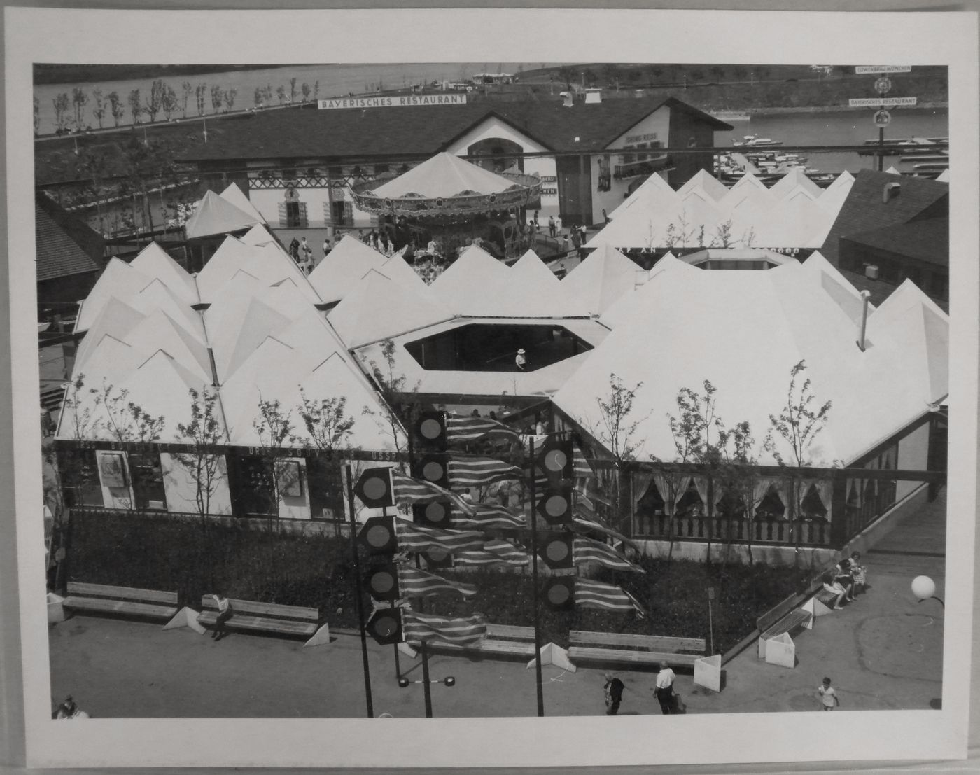 View of the Carrefour International with the carousel and the Baverisches restaurant at La Ronde, Expo 67, Montréal, Québec