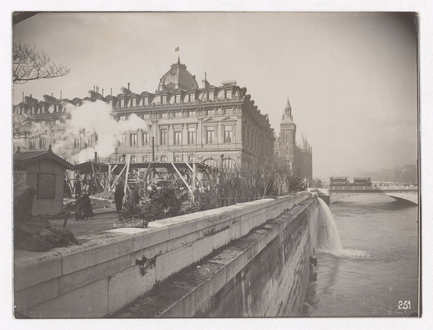 Construction of the Paris Metro, exterior view with smoke stacks and machinery next to the Seine, Paris, France