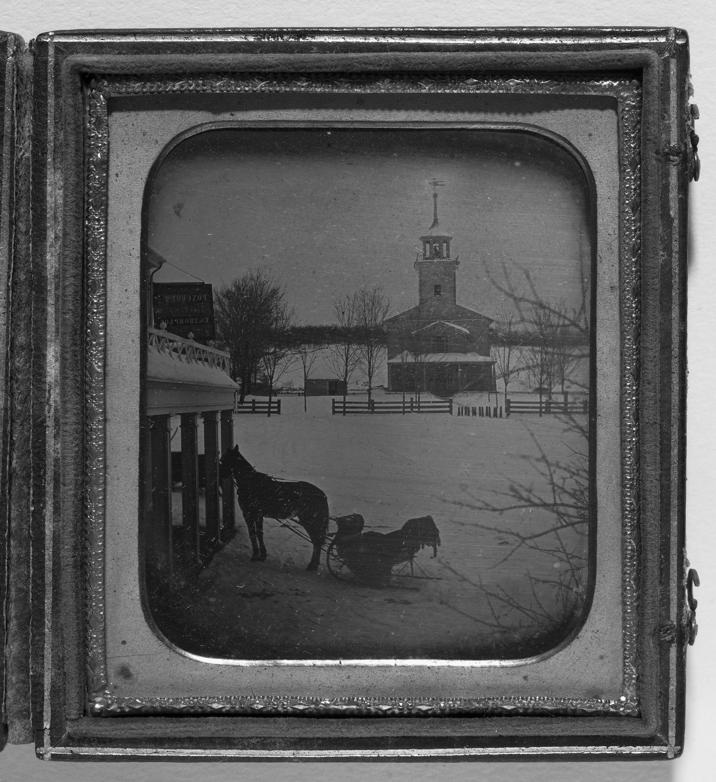 Church and country inn in the snow, possibly New England