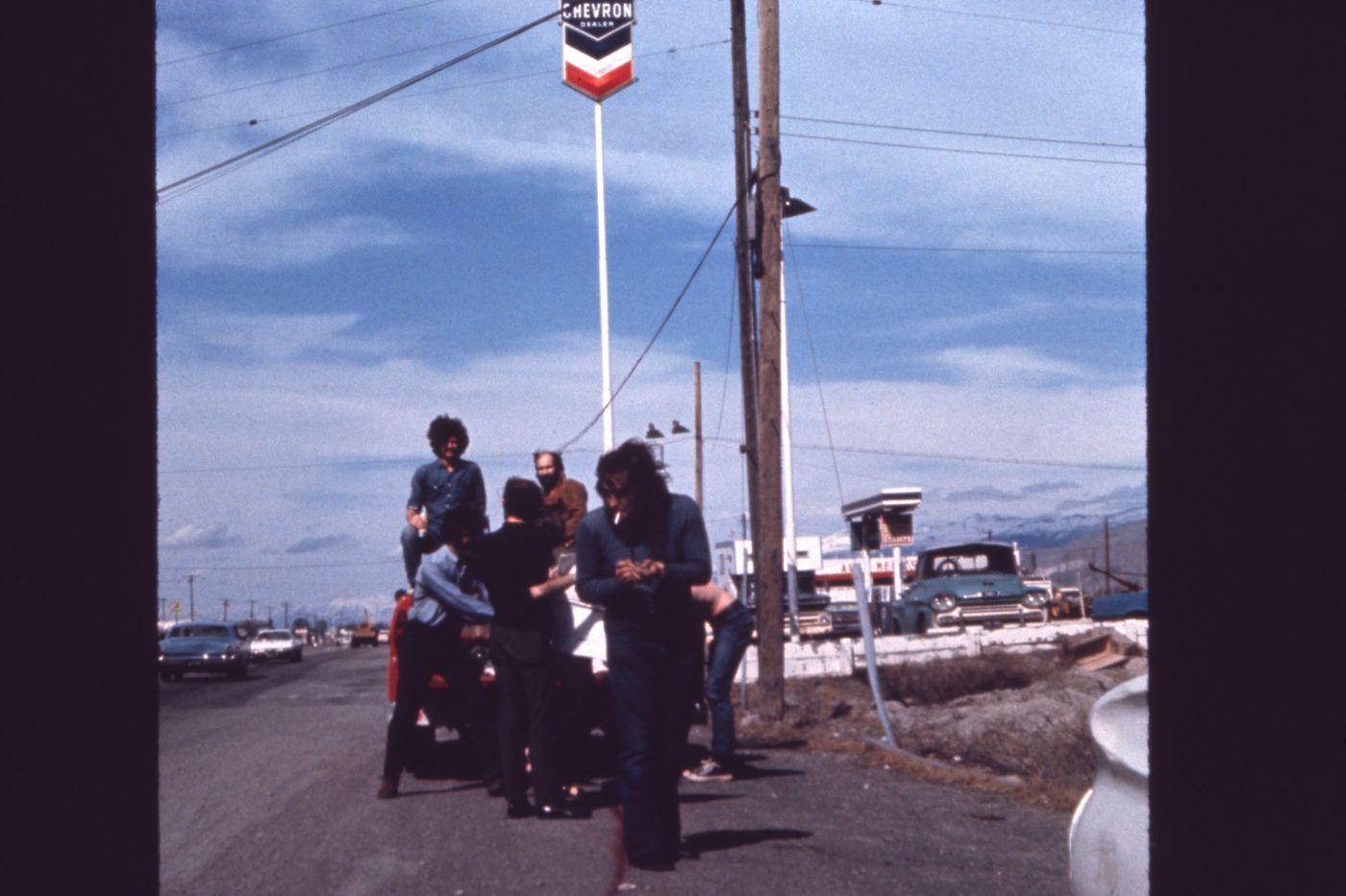Photograph of truck near gas station with students for Red Line