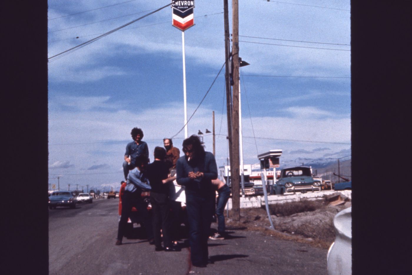 Slide of truck near gas station with students for Red Line