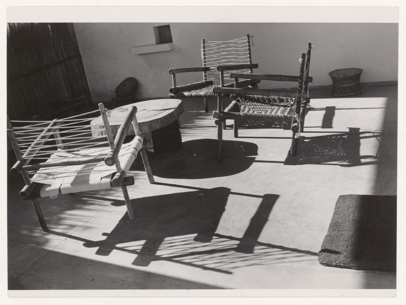 View of bambou armchairs and a wood table designed by Pierre Jeanneret in the loggia of his house, Sector 5, Chandigarh, India