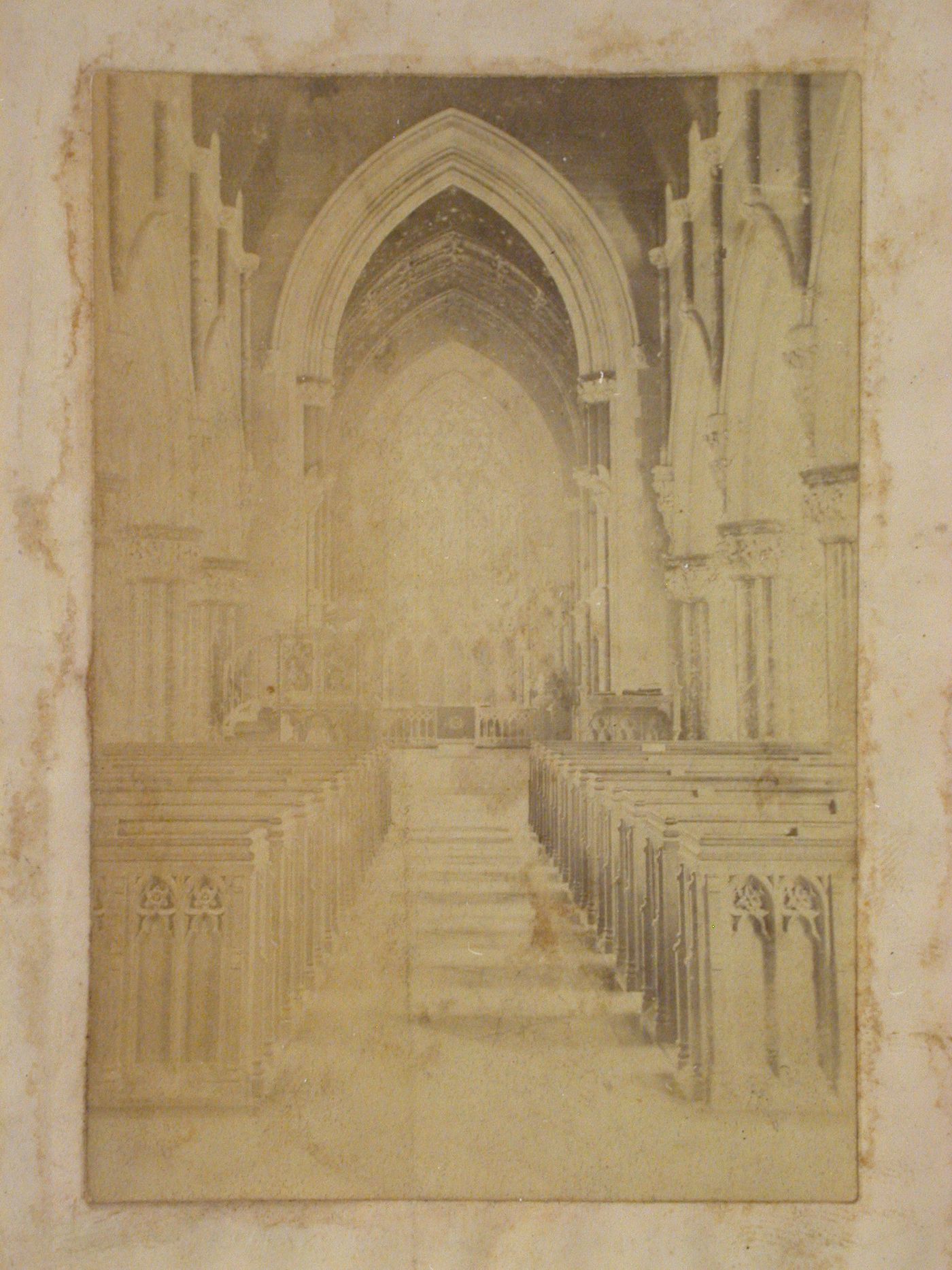 Interior view of a church looking up the central aisle of the nave towards the altar, England