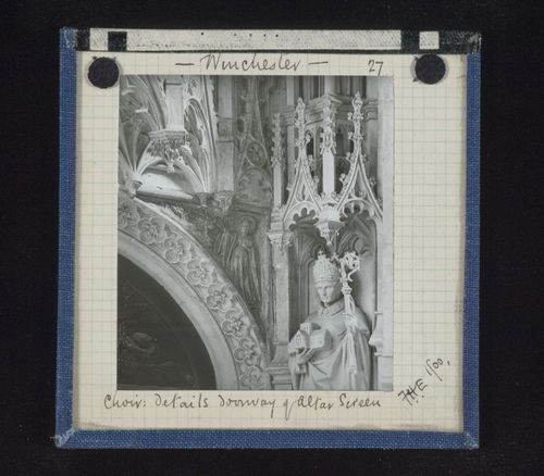 Detail view of sculpture and carving around doorway of altar screen, Winchester Cathedral, Winchester, Hampshire, England