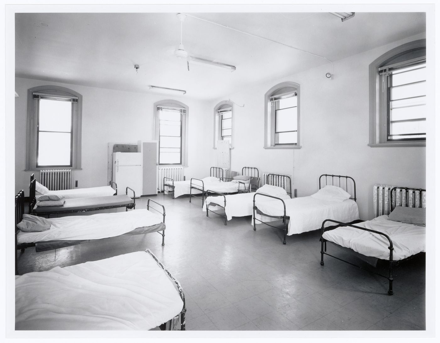 Interior view of the dormitory on the second floor of Fire Station no. 15, Richmond Street, Montréal, Québec
