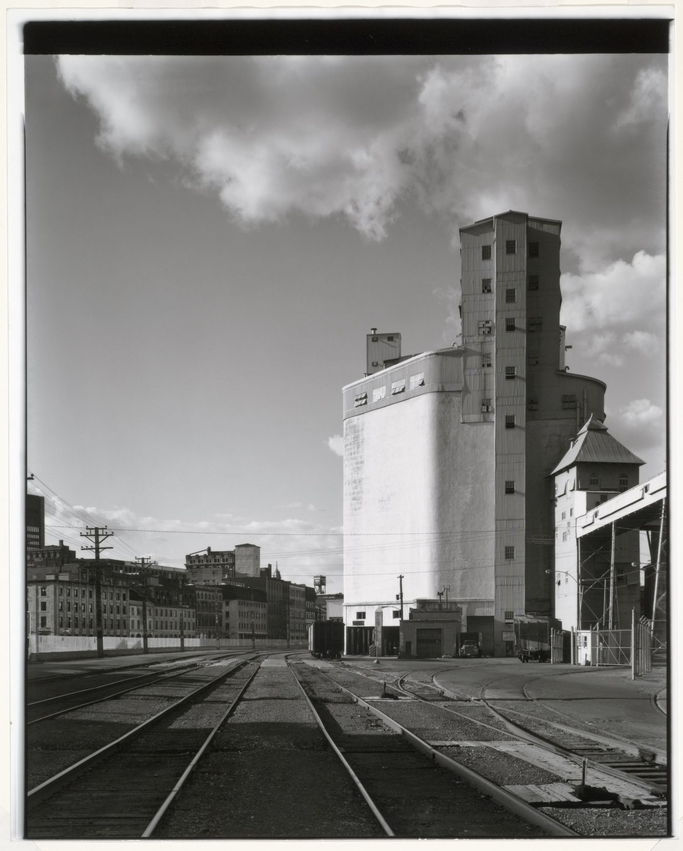 View of Grain Elevator No. 1 (now demolished) showing a conveyor gallery and railway tracks, Port of Montréal, Québec