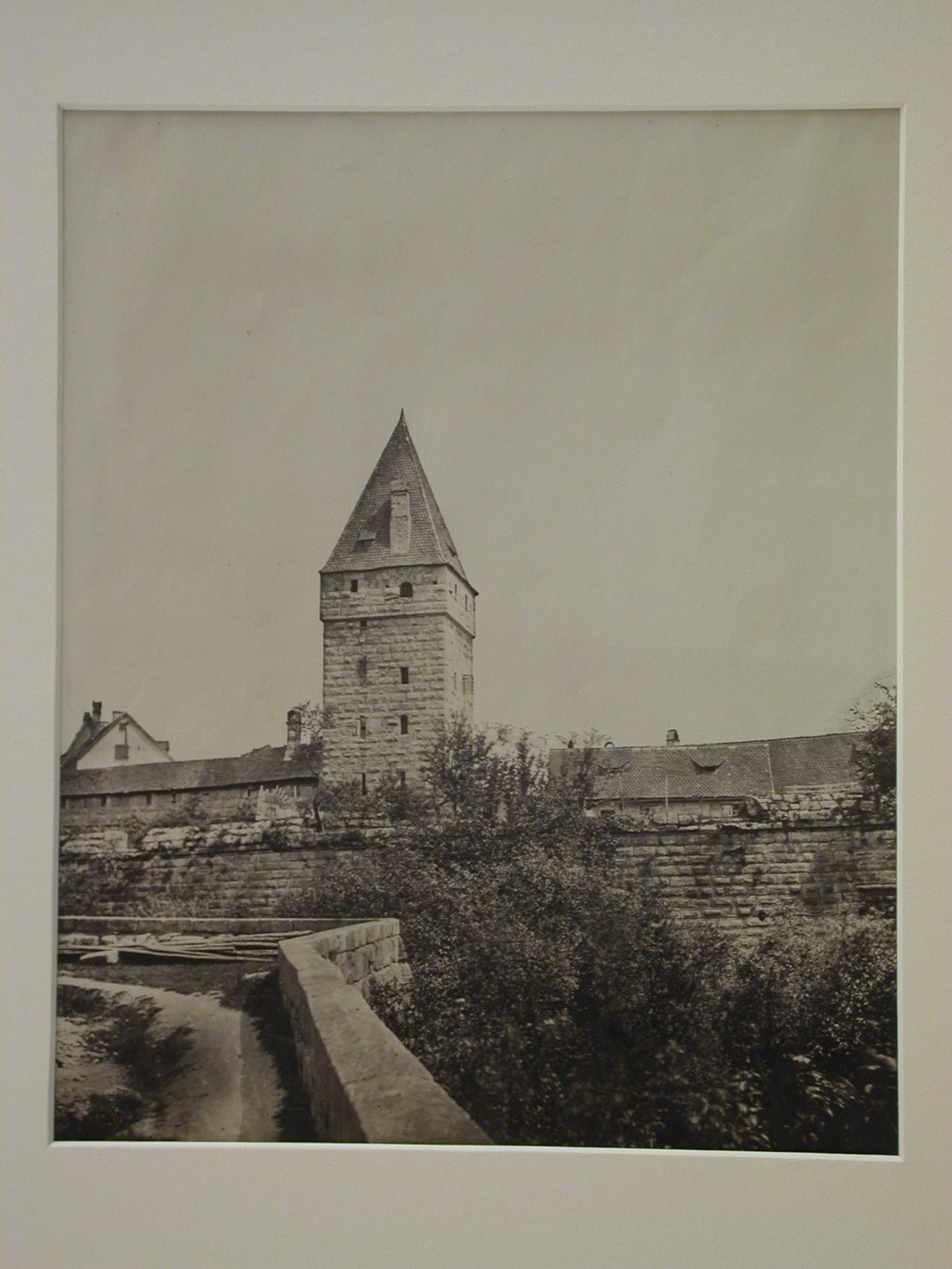 View of Kaiserburg [?] tower with portion of medieval city fortifications in foreground, Nuremberg [?], Germany