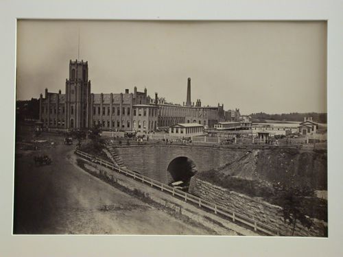 Springfield Armory looking down road to pond and water shops, entrance, Massachusetts