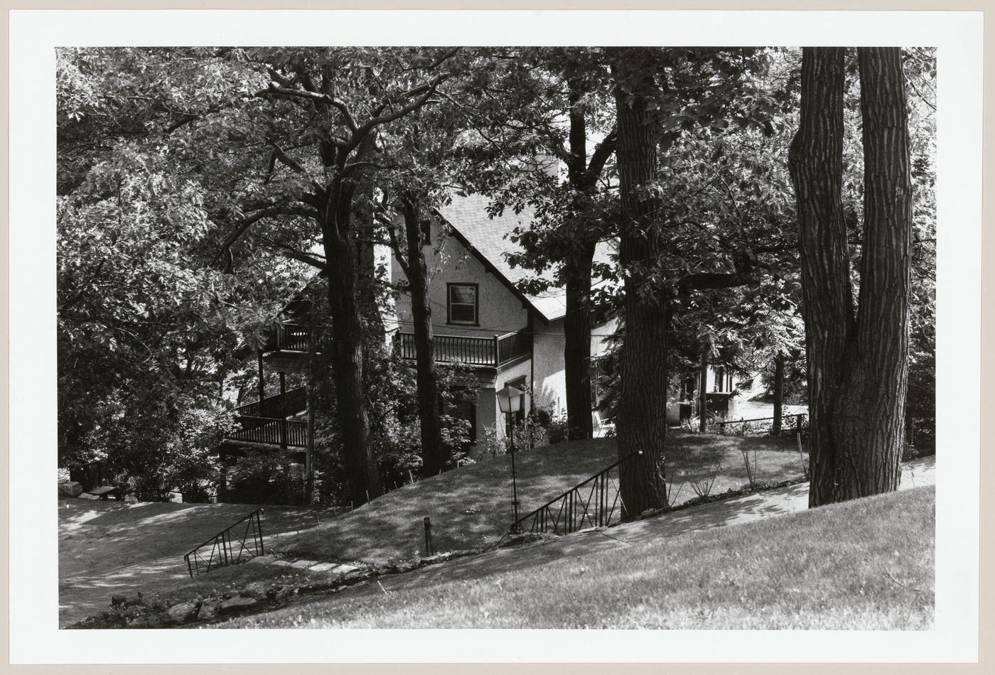 View of a house from the street above, 42-46 Summit Circle, Westmount, Québec