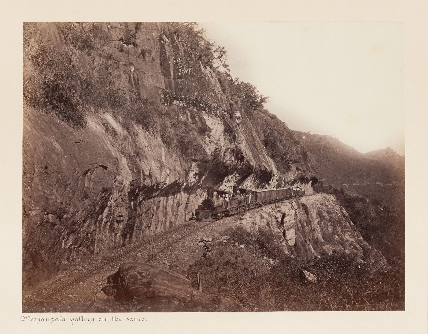 View of a train on the Colombo-Kandy Railway, Ceylon (now Sri Lanka)