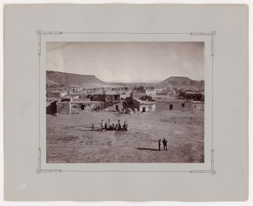 View of houses around main plaza of Katishtya (San Felipe Pueblo) showing mesas and the Rio Grande river visible in the distance, New Mexico, United States