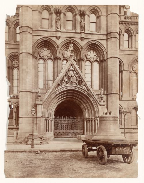 Detail of entrance to the new Town Hall, showing a cart loaded with a bell in the foreground, Manchester, England