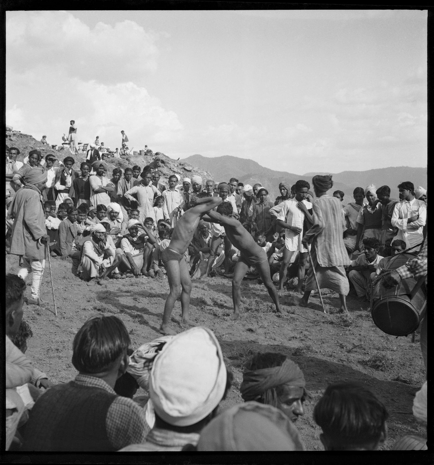 Crowd watching a wrestling match in Chandigarh's area before the construction, India