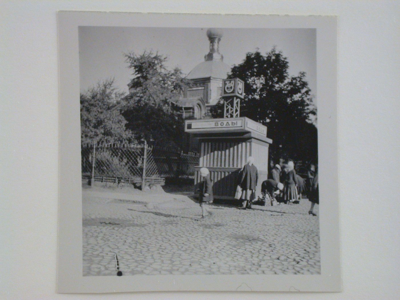 View of a kiosk with church in the background