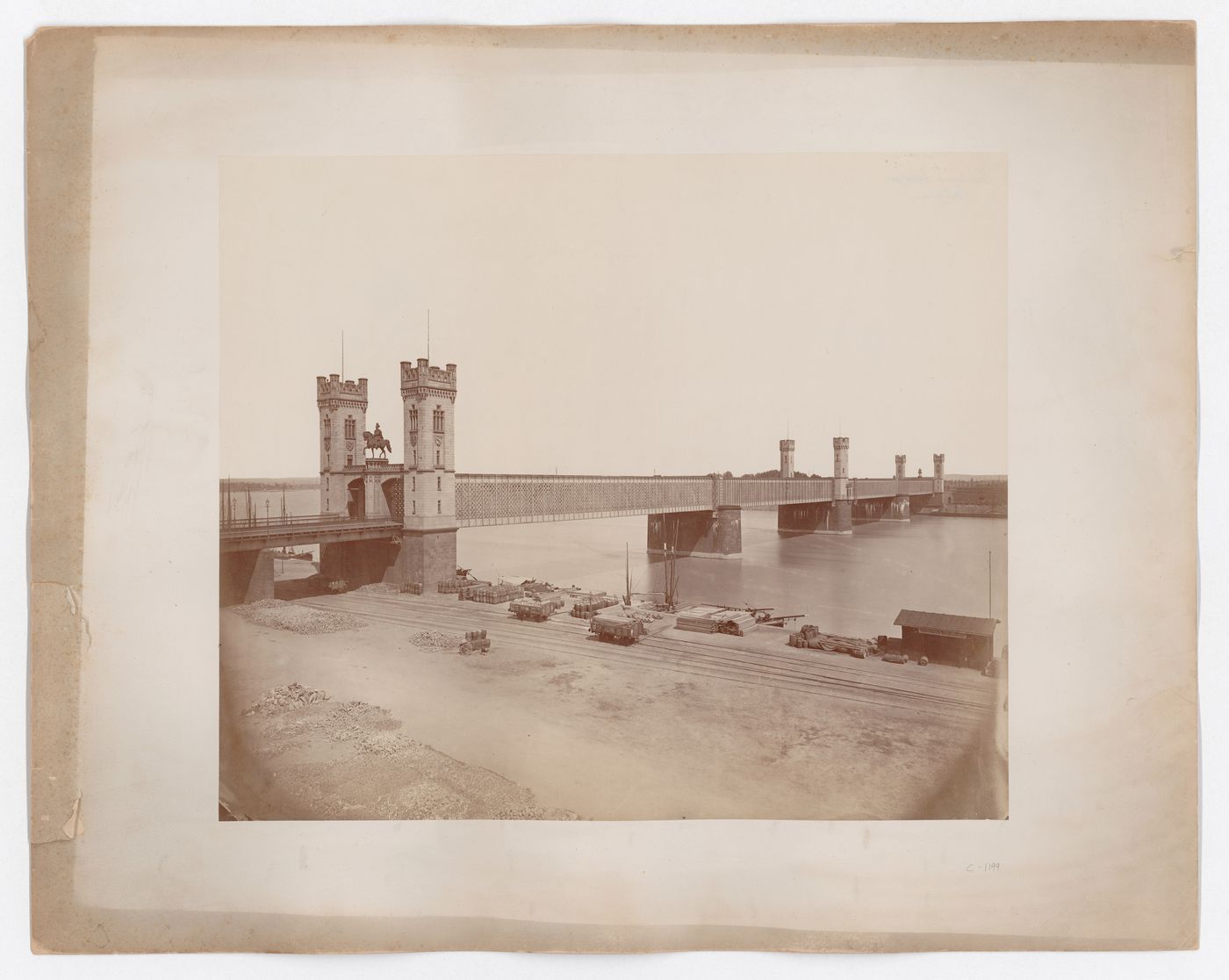 View of lattice-enclosed bridge with stone turrets, Cologne, Germany