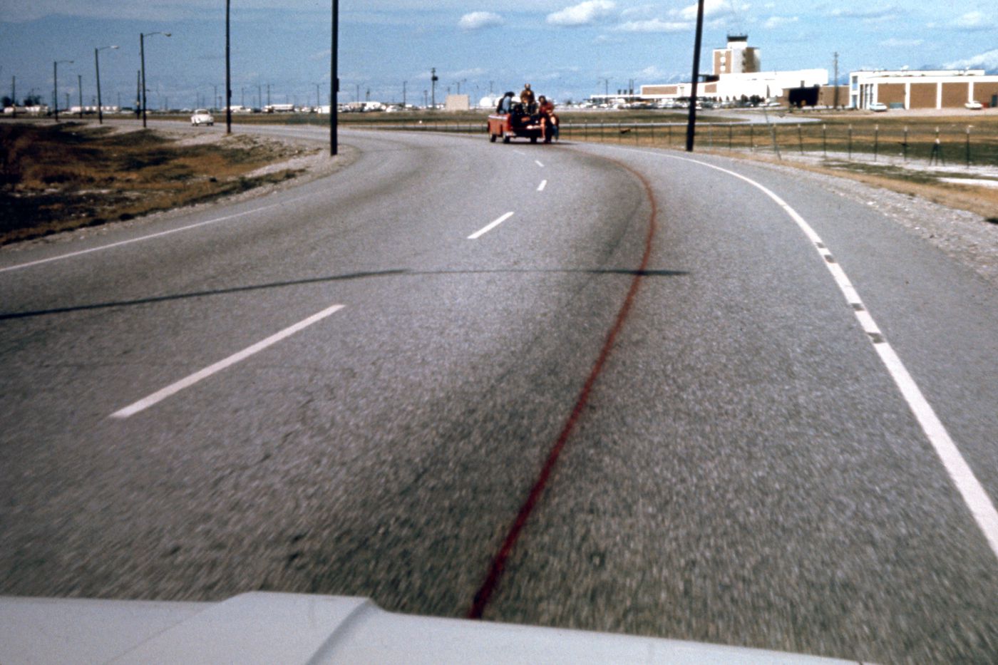 Photograph of truck spraying road for Red Line