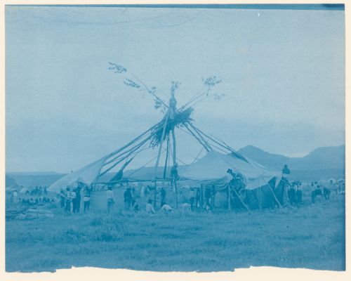View of a round lodge under construction, probably a Cheyenne Sun Dance lodge, United States