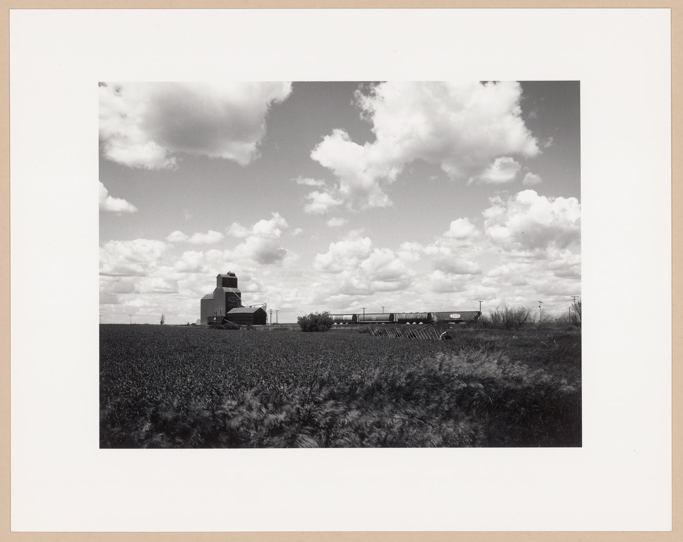 Plow, grain elevator, train, Fairlight, Saskatchewan, from the series The Forms of Canadian Industrial Architecture
