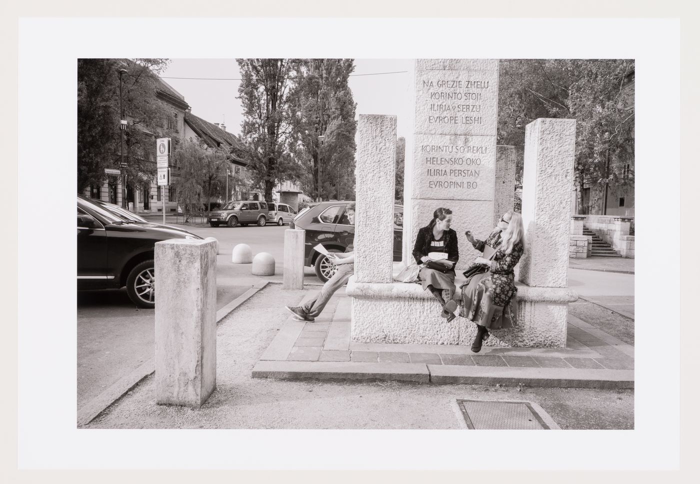 People sitting at Revolution Square Monument, Ljubljana, Slovenia