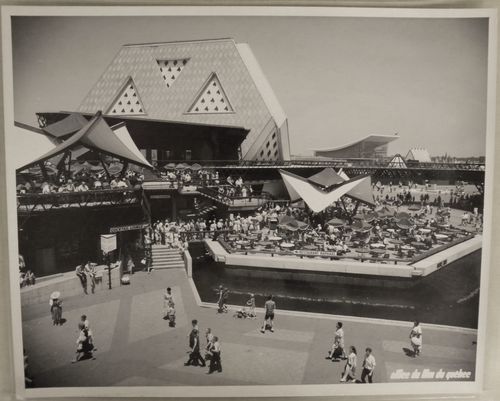 View of terraces at the Plaza of the Universe near the Man the Explorer Pavilion with the Pavilion of the Soviet Union in background, Expo 67, Montréal, Québec
