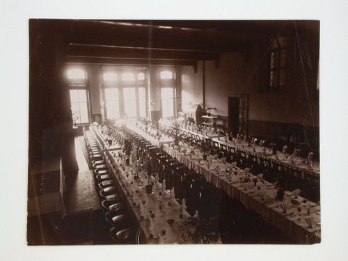 Interior view of a dining hall showing multiple tables with elaborate dinner settings, possibly in Derbyshire, England