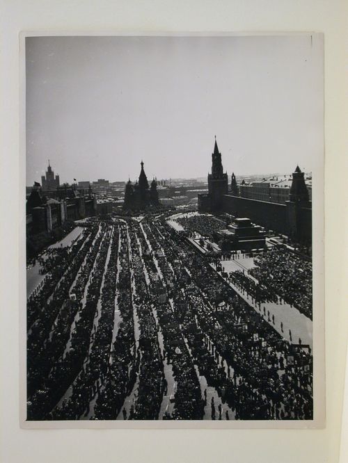 View of a demonstration in Red Square from an elevated viewpoint with the Upper Shopping Arcades, Saint Basil Cathedral, the Spasskaia Tower, the Senate Tower and the stone Lenin Mausoleum in the background, Moscow